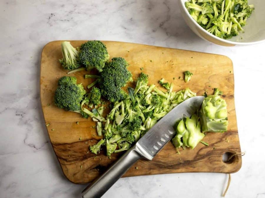 CUTTING BROCCOLI INTO SMALL FLORETS WITH A KNIFE