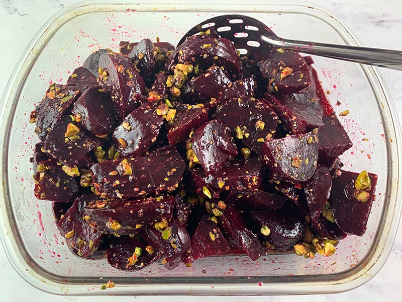 MIXING ROASTED BEET SALAD WITH PISTACHIOS & CARDAMOM VINAIGRETTE
