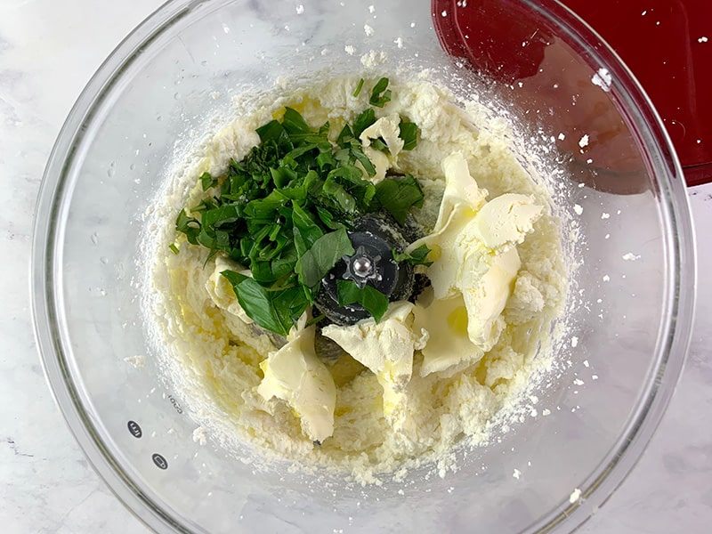 BLITZED FETA WITH BASIL, LEAVES, CREAM CHEESE & OLIVE OIL IN A FOOD PROCESSOR