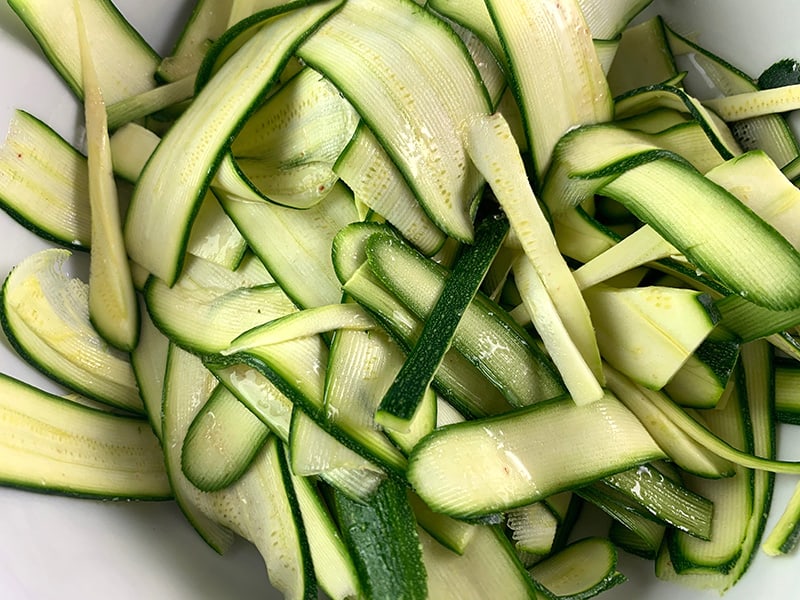 Zucchini ribbons in a bowl.