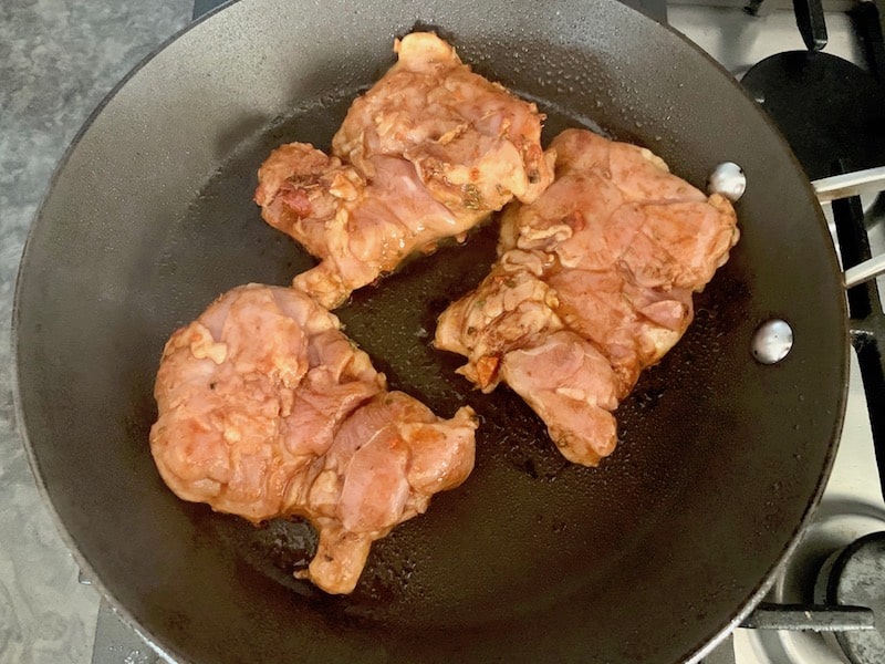 ADDING CHICKEN THIGHS TO HOT PAN