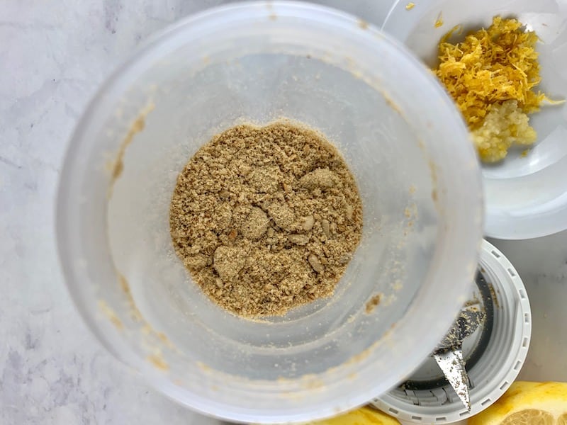 SUNFLOWER SEEDS IN BLENDER BLITZED TO A POWDER WITH LEMON ON THE SIDE