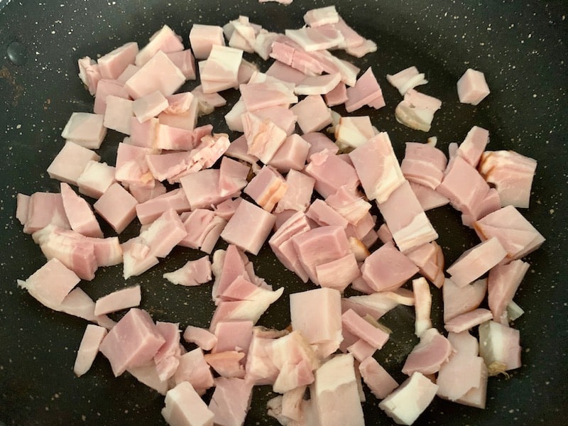 ADD DICED BACON TO HOT PAN