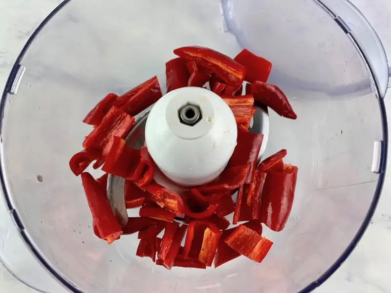 CHOPPED CHILLIS IN THE BOWL OF A FOOD PROCESSOR