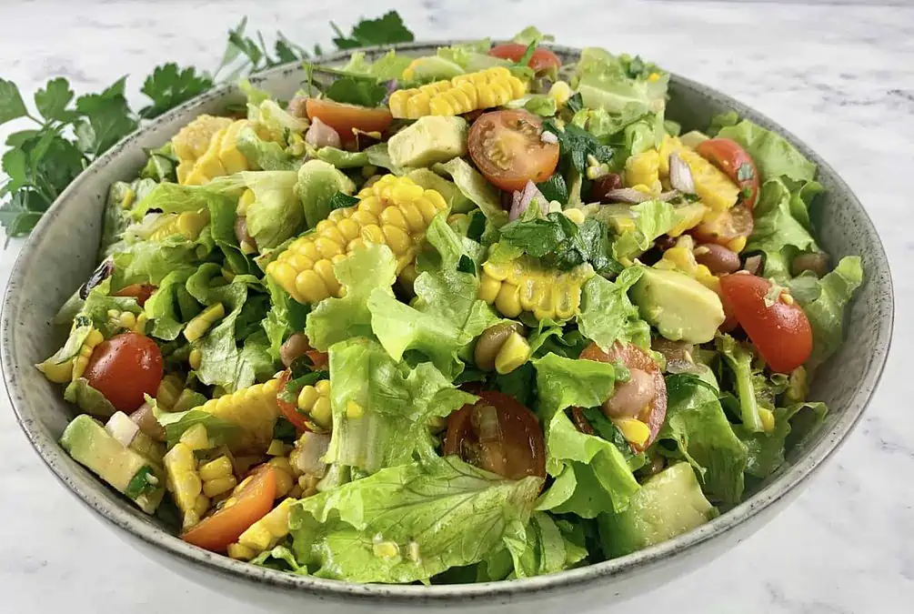FIESTA SALAD IN A SALAD BOWL WITH PARSLEY ON THE SIDE
