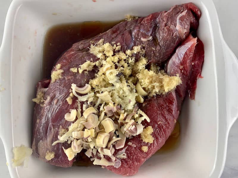 BEEF FILLETS IN BOWL WITH MARINADE INGREDIENTS