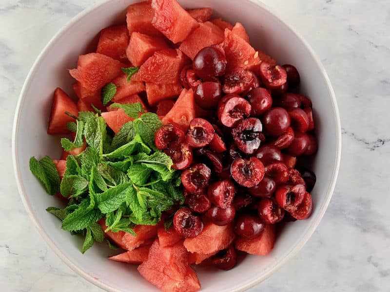 ADDING ALL WATERMELON FRUIT SALAD INGREDIENTS TO BOWL