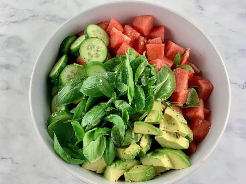 WATERMELON AVOCADO SALAD INGREDIENTS IN A WHITE BOWL
