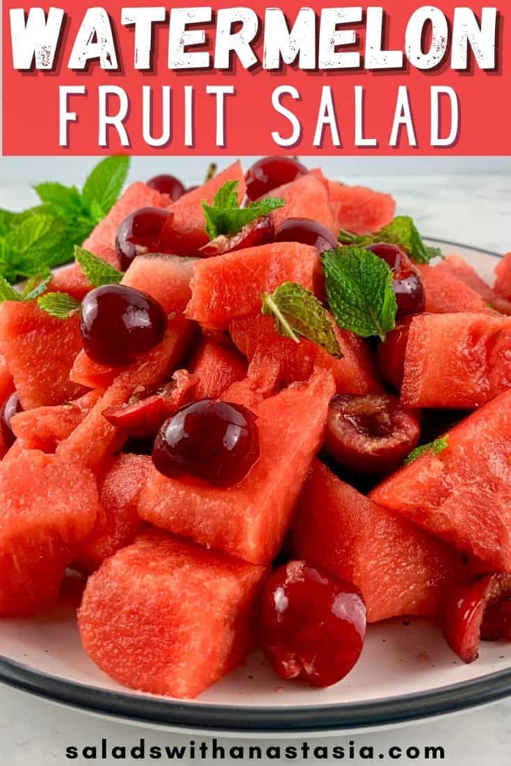 WATERMELON FRUIT SALAD ON A PLATTER WITH CHERRIES AND MINT WITH TEXT OVERLAY