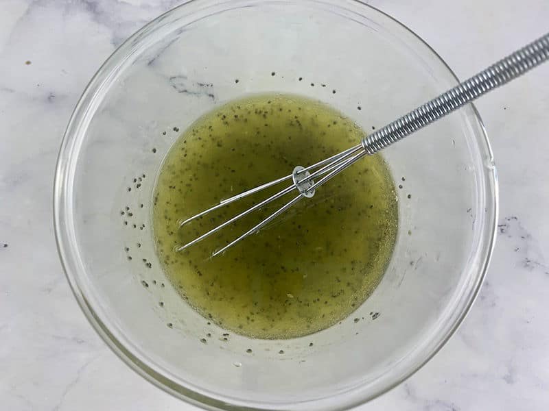 DRESSING INGREDIENTS IN BOWL WITH SMALL WHISK