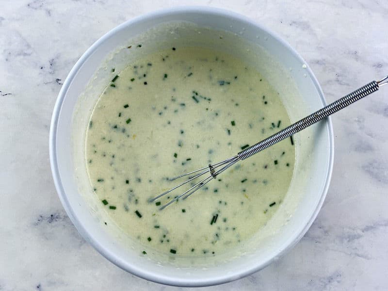 Whisking buttermilk Dressing ingredients to combine