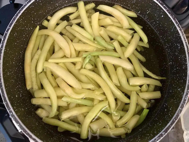 YELLOW BEANS IN POT OF BOILING WATER