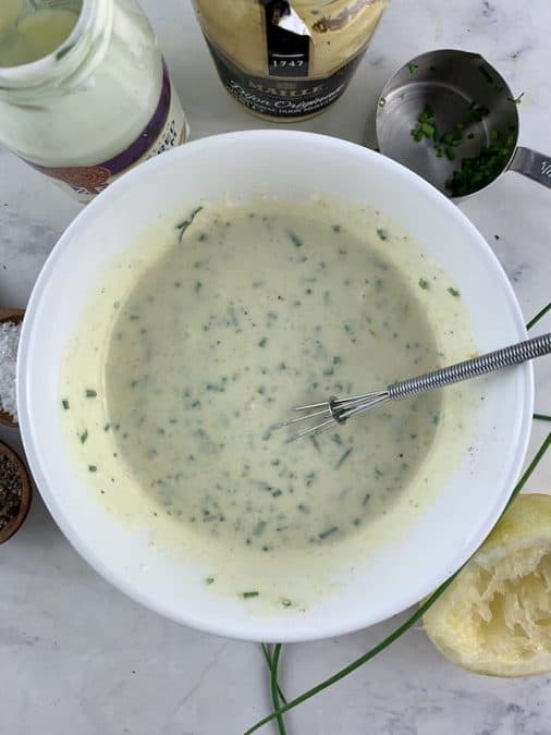 WHISKING SOUR CREAM & CHIVE DRESSING TO COMBINE