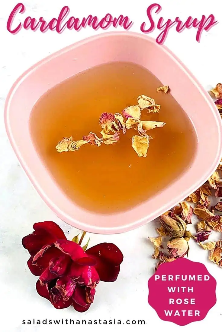 CARDAMOM SYRUP IN A PINK BOWL WITH ROSE & ROSE PETALS ON THE SIDE & TEXT OVERLAY