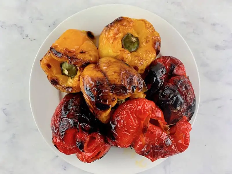 Roasted peppers on a white plate.