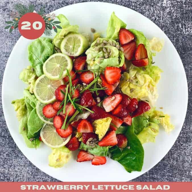 Lettuce salad with strawberries on a white plate with the number 20 and text overlay.