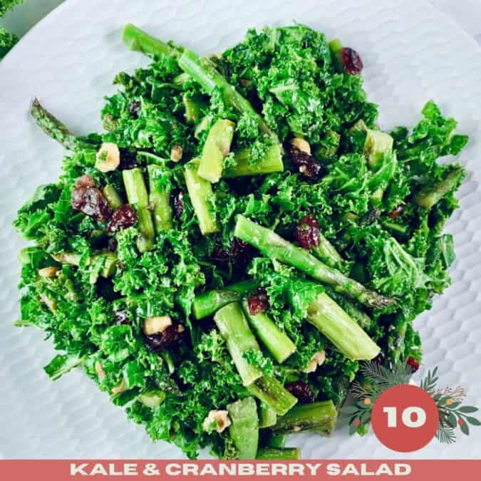 Kale and Cranberry Salad on a white platter with Xmas text overlay..