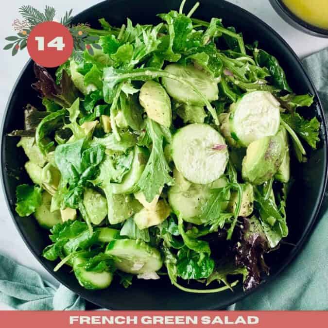 French green salad in a black bowl with mint linen napkin and dressing in top right corner, with a xmas text overlay.