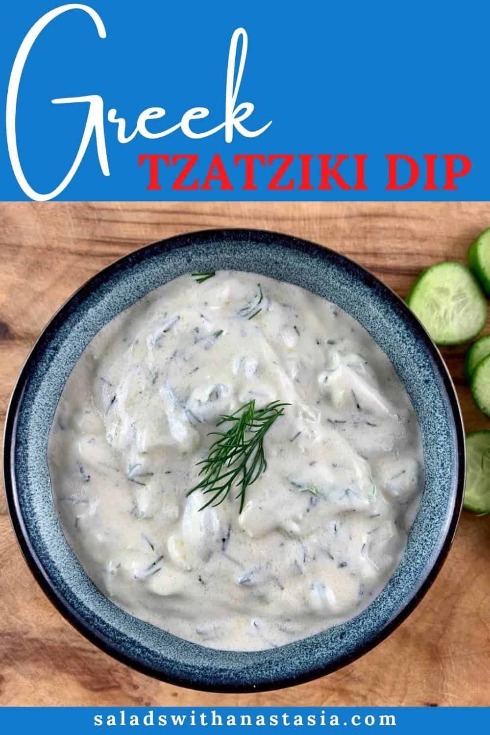 Our Authentic Tzatziki Recipe in a blue bowl with cucumber slices on top right sitting on a wooden board and with a text overlay.