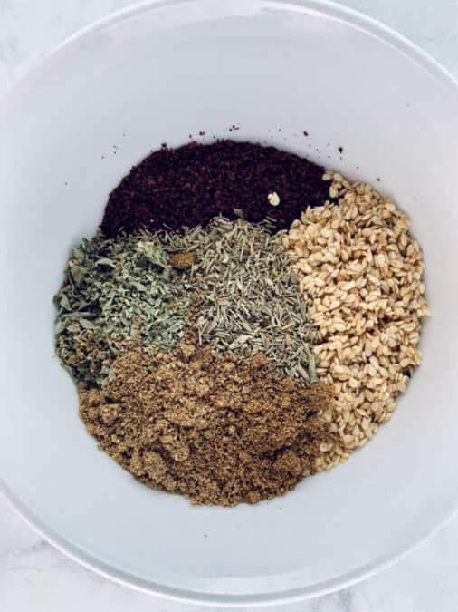 Za'atar subsitute ingredients in a white bowl.