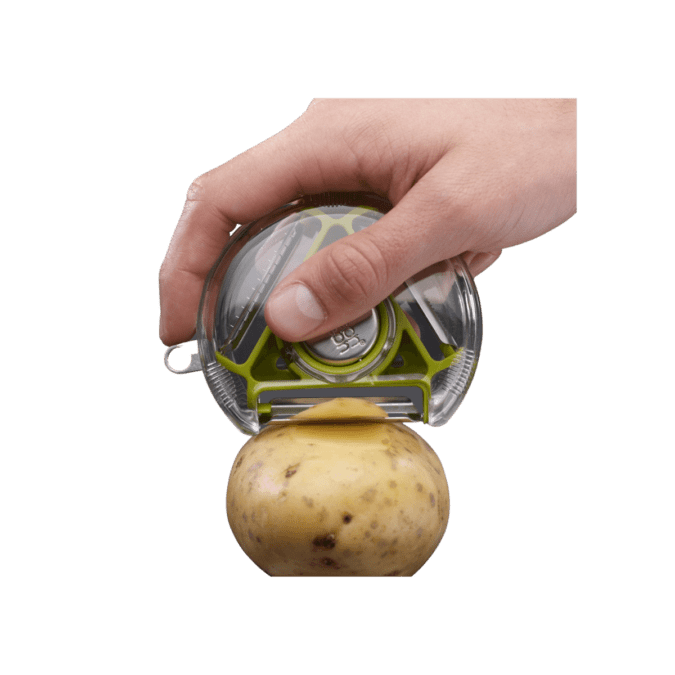 A hand holding a rotary peeler and peeling a potato.