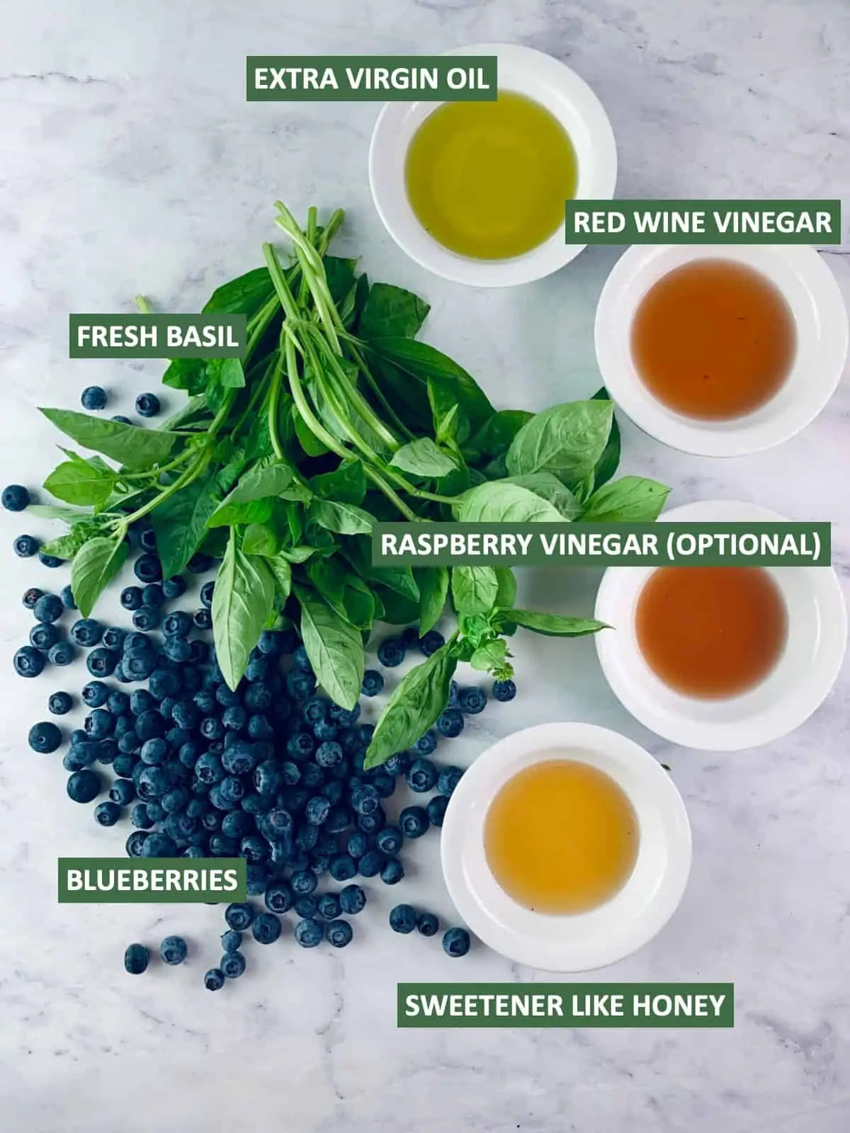 Labelled ingredients needed to make blueberry salad dressing.