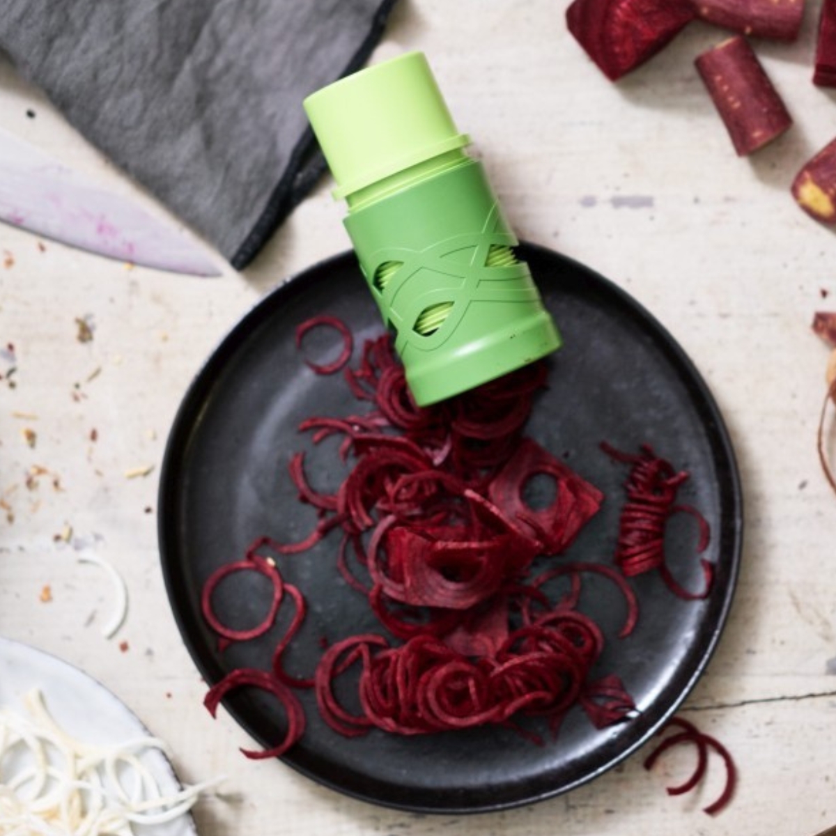 Aerial view of betty bossi spiralizer on a plate with spirals.