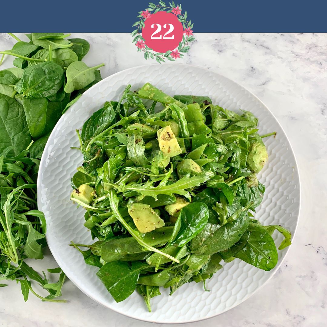 Spinach Arugula salad with the number 22 and Xmas graphics.