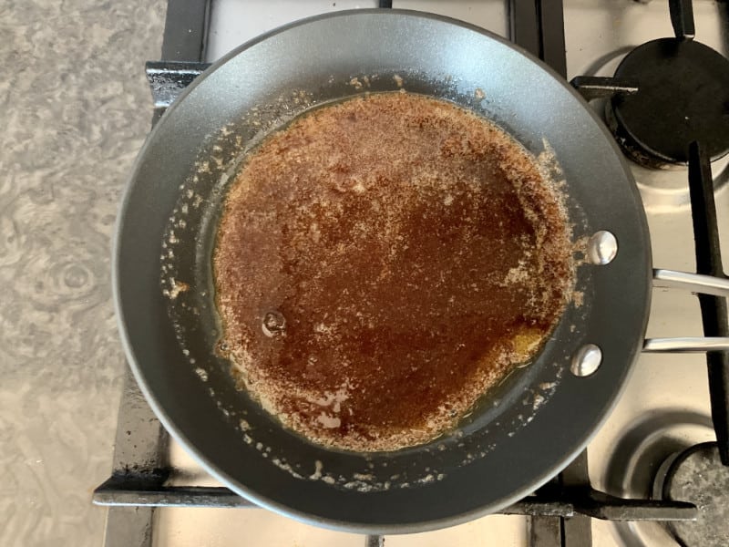 Melted butter and sugar in a pan on the stove.