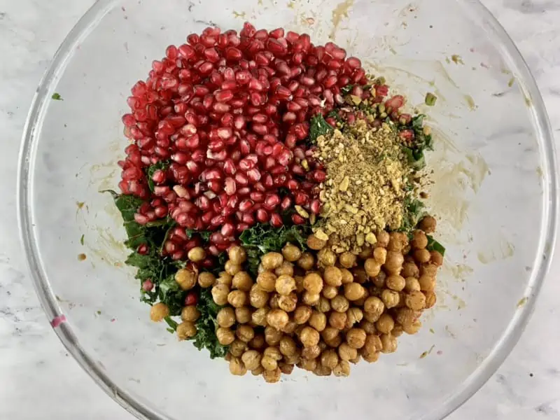 Prepared kale pomegranate ingredients in a bowl.