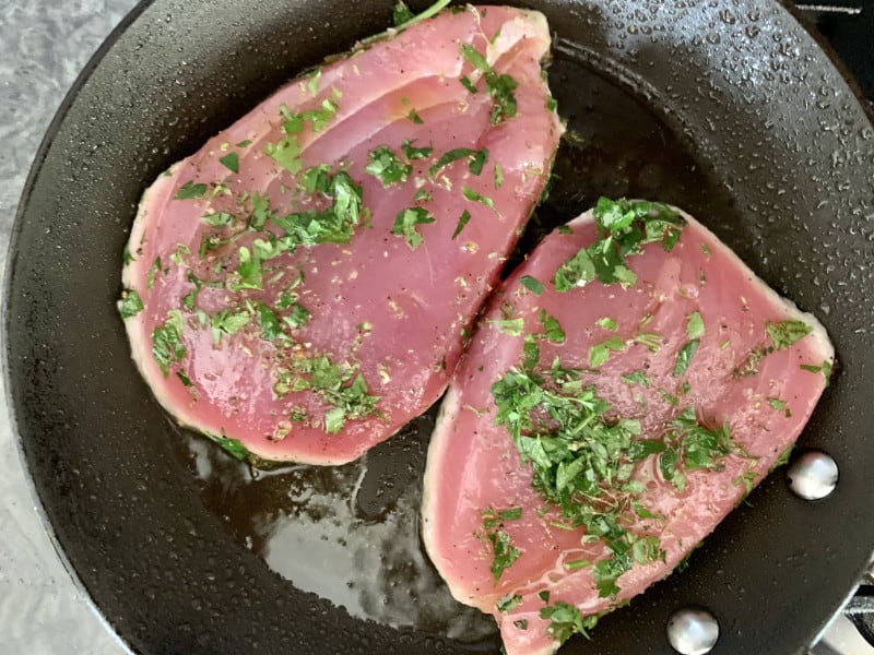 Tuna steaks in pan.