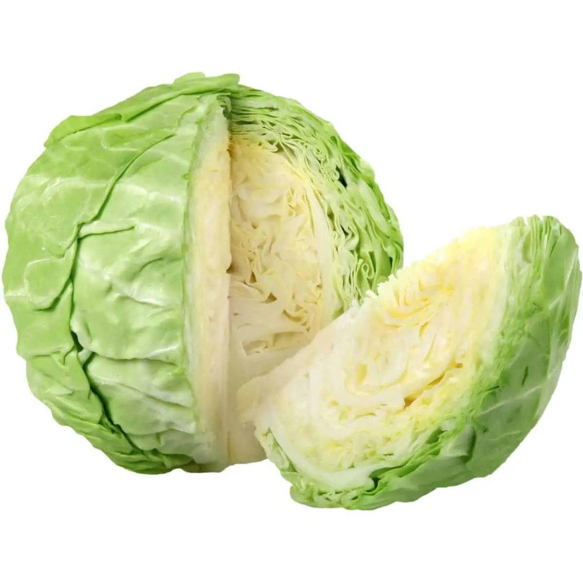 A head of green cabbage with a wedge cut out lying next to it.